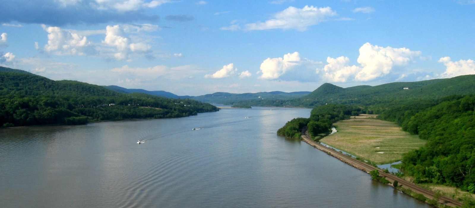 river landscape boats hills