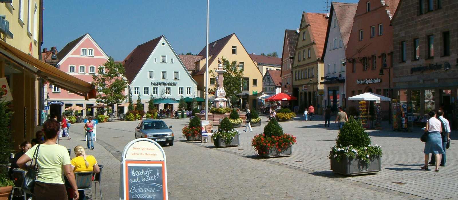 town square buildings cobblestone street