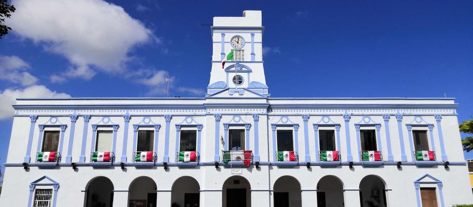 town hall building mexican flags
