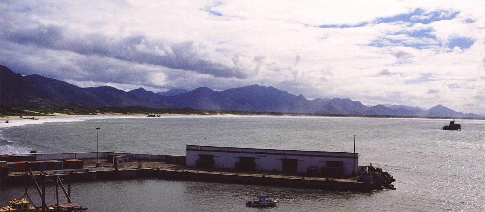 harbor coastline mountains boats