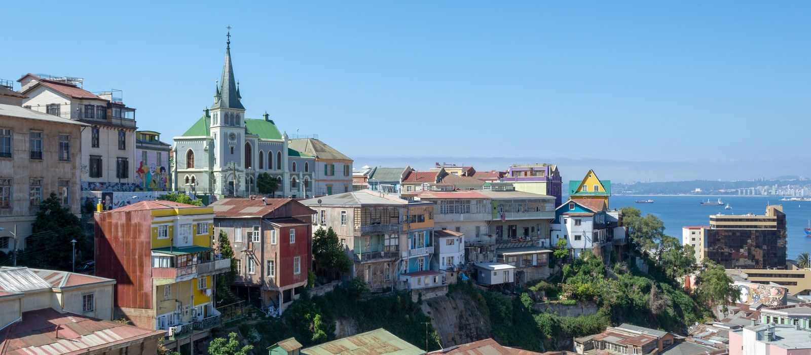 colorful buildings on hillside overlooking harbor
