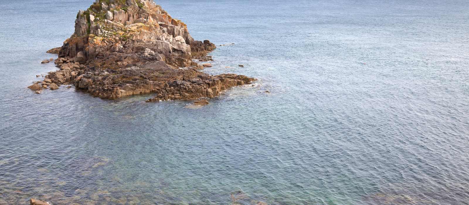rocky island coastline sea