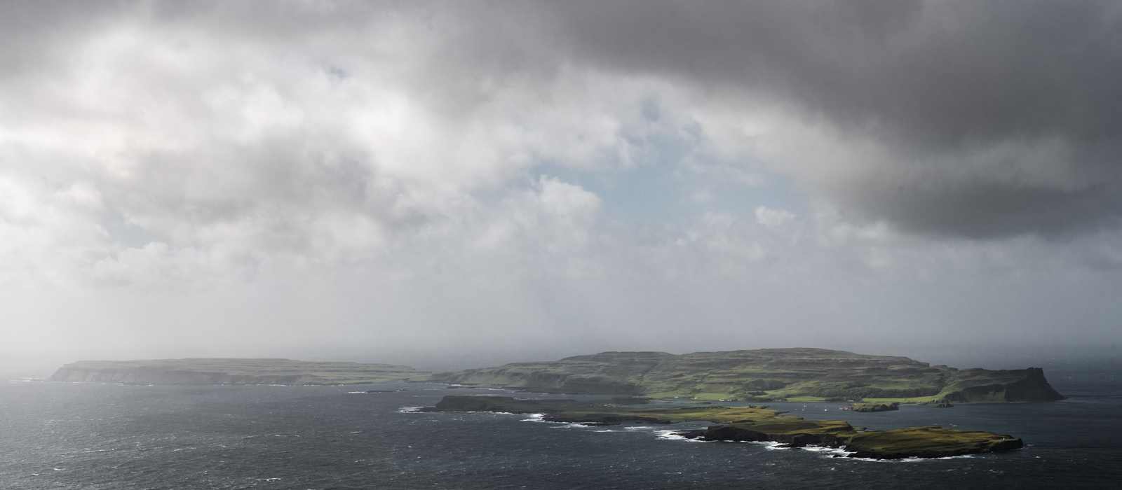 islands coastline sea clouds