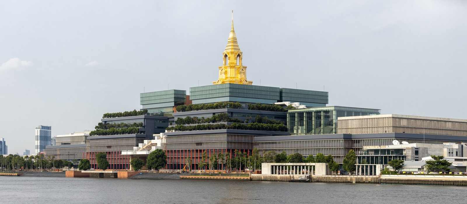 cityscape river modern architecture gold spire