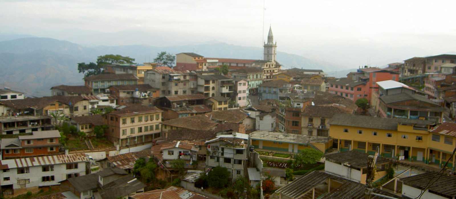 cityscape mountains town