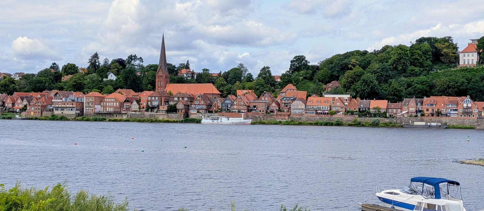 waterfront town church spire boats