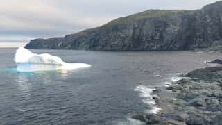 iceberg coastline ocean cliffs