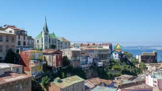 colorful buildings on hillside overlooking harbor