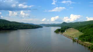 river landscape boats hills