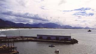 harbor coastline mountains boats