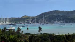 harbor sailboats coastline tropical island
