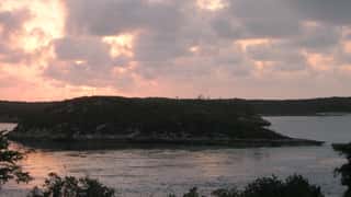 island coastline water sunset