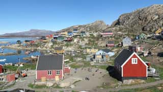 coastal village colorful houses mountains