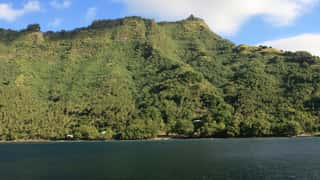 tropical coastline mountains ocean