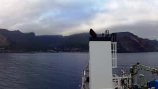 island coastline sea ship