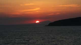 sunset ocean islands coastline
