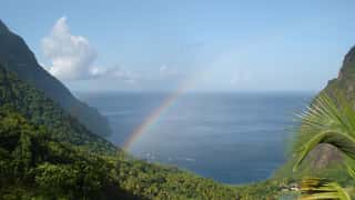 tropical coastline rainbow boats