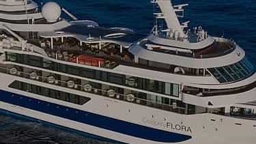 A cruise ship sails on the deep blue sea - Celebrity Flora, Celebrity Cruises