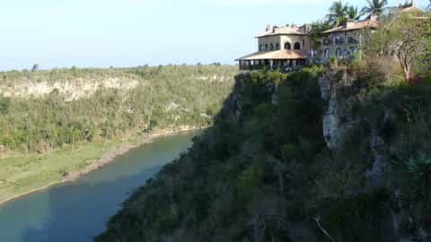 river cliffside buildings landscape