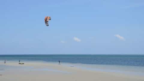beach ocean kite surfer