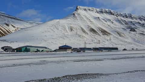 snowy mountains and buildings