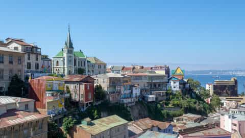 colorful buildings on hillside overlooking harbor