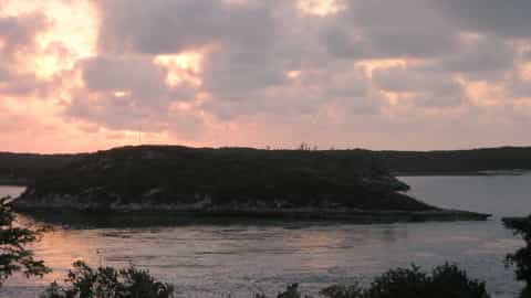 island coastline water sunset