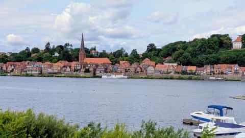 waterfront town church spire boats