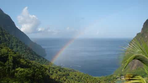 tropical coastline rainbow boats