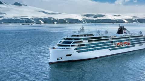 A cruise ship sails through icy Antarctic waters - Viking Octantis, Viking Cruises