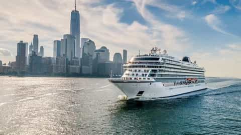 A cruise ship sails past the New York City skyline - Viking Saturn, Viking Cruises