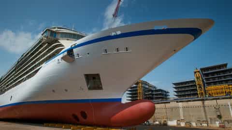 Cruise ship in dry dock with construction cranes - Viking Star, Viking Cruises