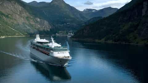 A cruise ship sails through a Norwegian fjord - Vision Of The Seas, Royal Caribbean