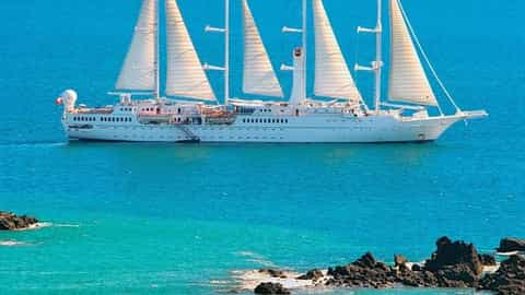 A large white sailing ship with four masts at sea - Wind Spirit, Windstar Cruises