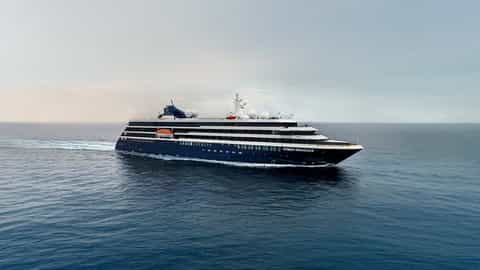 A cruise ship sails on the open sea - World Traveller, Atlas Ocean Voyages