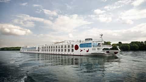 A white river ship sails on the water - Arosa Aqua, A Rosa Cruises