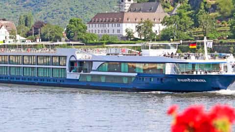 A blue river ship sails on the water - Avalon Panorama, Avalon Waterways