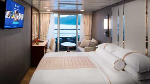 A suite with a balcony overlooking the water - Azamara Journey, Azamara Cruises