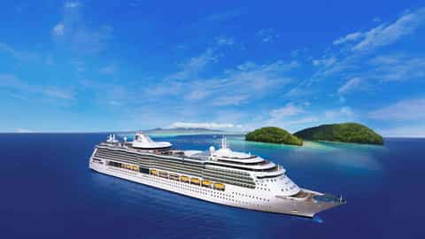 A large cruise ship sails on the ocean near tropical islands - Brilliance Of The Seas, Royal Caribbean