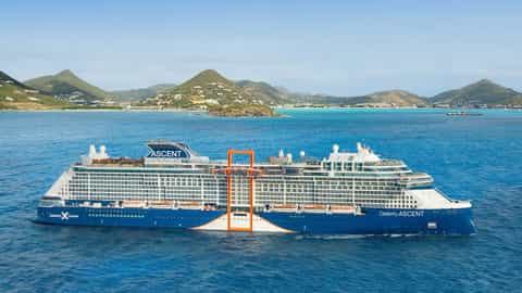 A large cruise ship sails on the ocean near land - Celebrity Ascent, Celebrity Cruises
