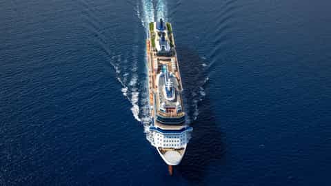 A cruise ship sails through the blue ocean - Celebrity Equinox, Celebrity Cruises