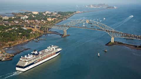 A cruise ship sails under a large bridge - Celebrity Infinity, Celebrity Cruises