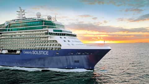A cruise ship sails on the ocean at sunset - Celebrity Solstice, Celebrity Cruises