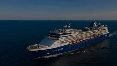 A large blue cruise ship sails on the ocean - Celebrity Summit, Celebrity Cruises