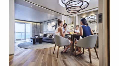 Four people enjoy breakfast in a suite with an ocean view - Discovery Princess, Princess Cruises