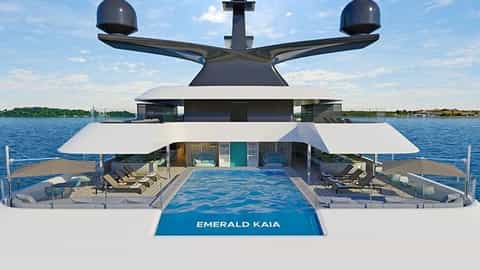 A modern yacht with a large pool and lounge area - Emerald Kaia, Emerald Cruises