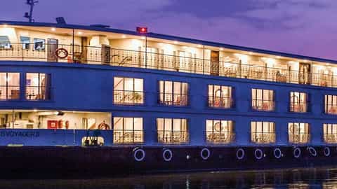 A river ship sails on the water at dusk - Ganges Voyager 2, Uniworld