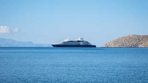 A dark blue cruise ship sails on the sea - Le Boreal, Ponant Cruises