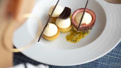 A dessert with cream tarts and passionfruit - Le Laperouse, Ponant Cruises
