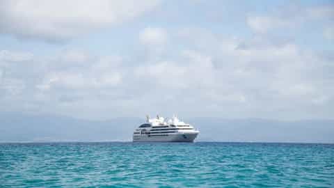 A cruise ship sails on the blue ocean - Le Lyrial, Ponant Cruises